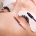 How are eyelash extensions usually attached?