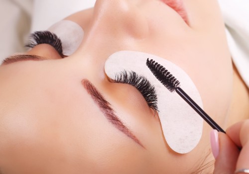 How are eyelash extensions usually attached?